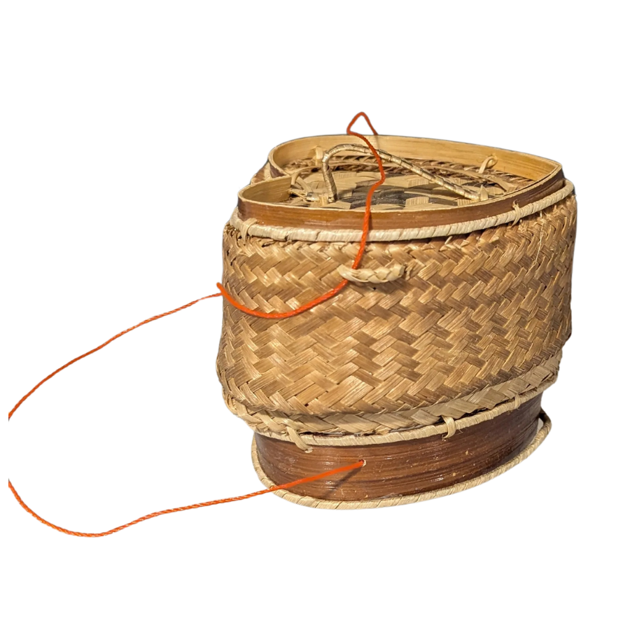 Woven spool with orange thread on a white background