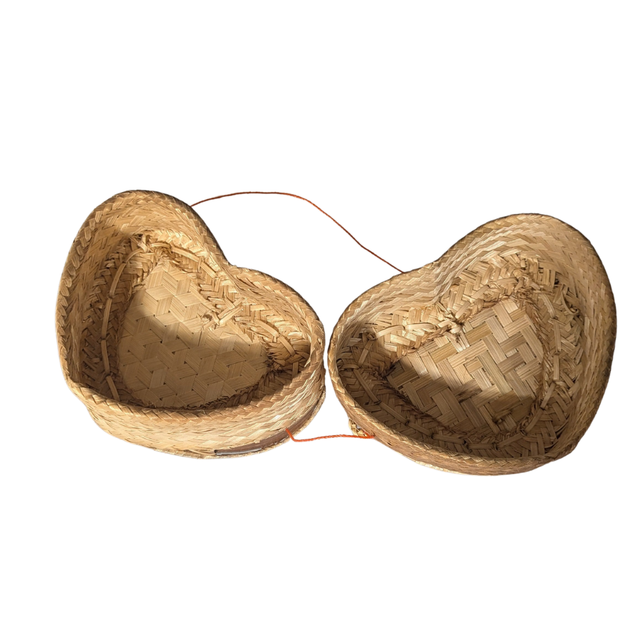 Two heart-shaped woven baskets on a white background