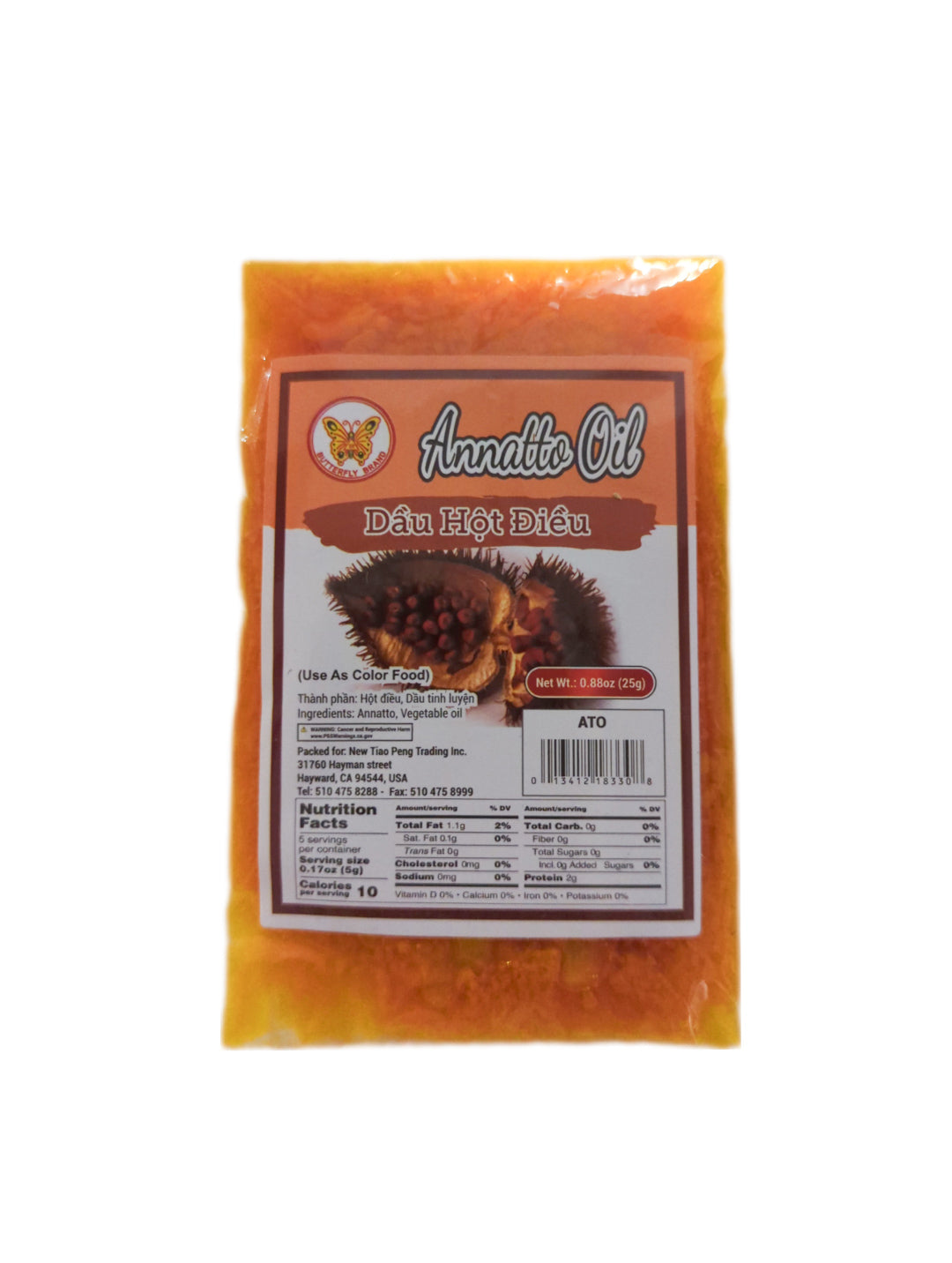A packet of Butterfly Brand Annatto Oil with an orange label featuring an image of annatto seeds and nutrition facts.