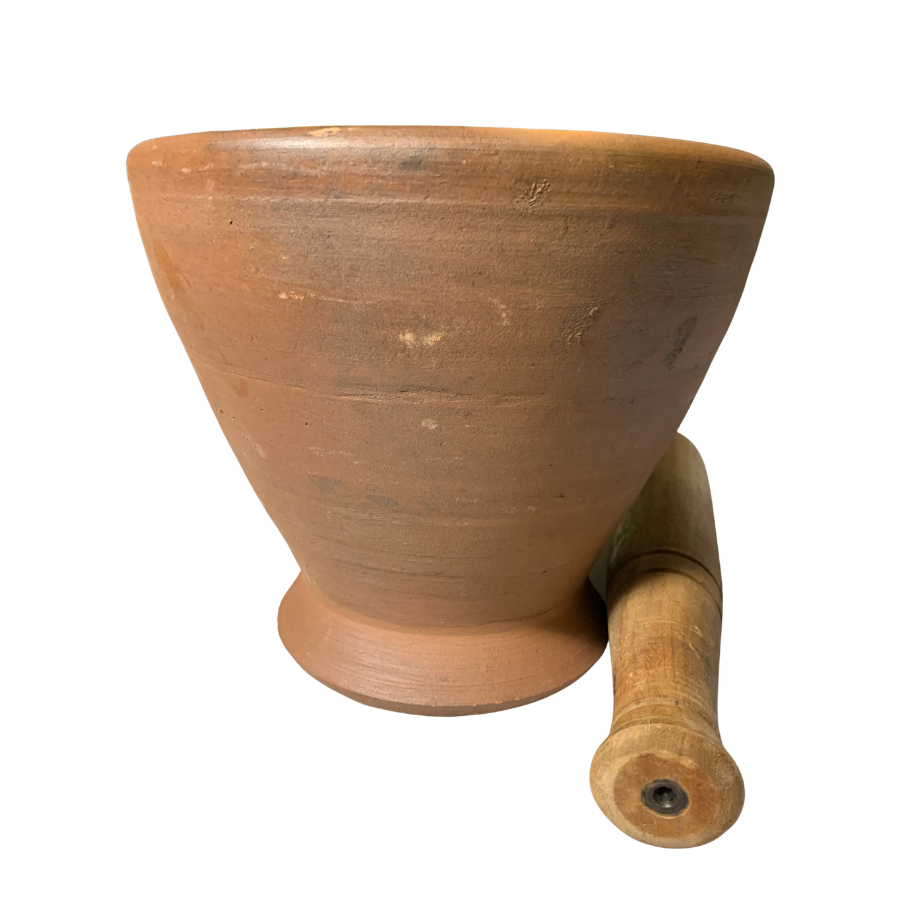 Terracotta mortar and pestle on a white background