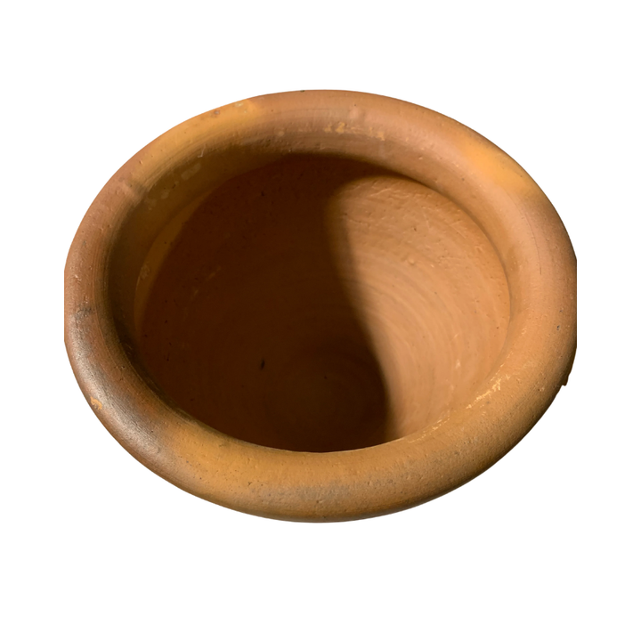 Aerial view of brown terracotta mortar on a white background