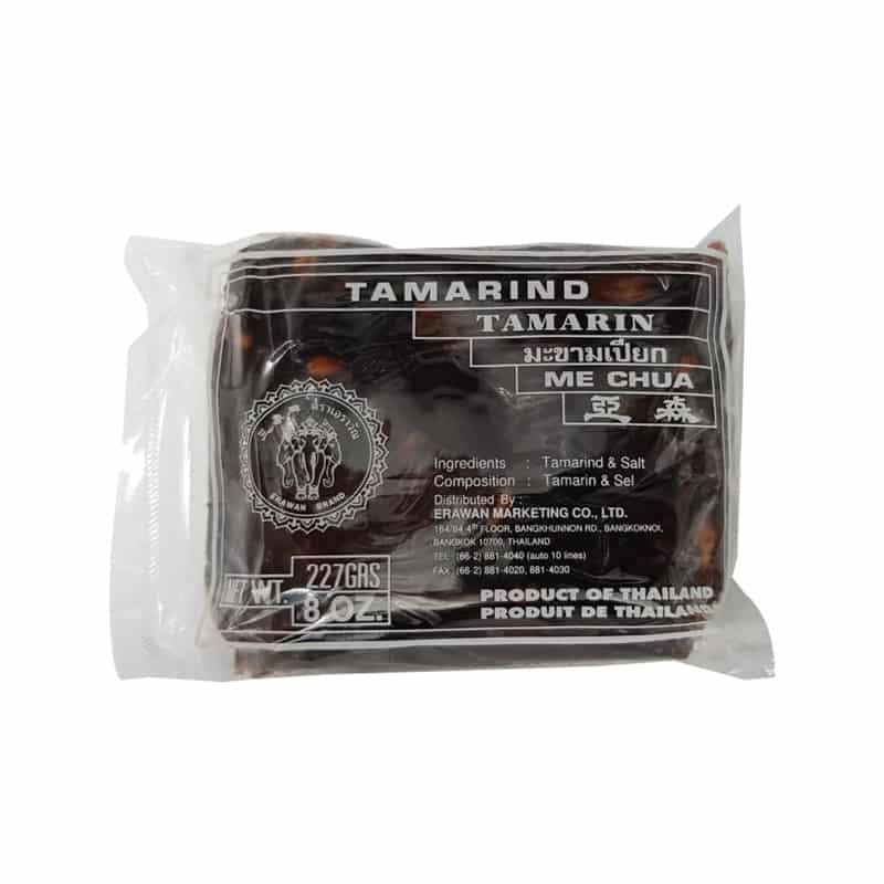 Small clear plastic packaging of brown Erawan Tamarind Paste with an image of white three headed elephants logo.