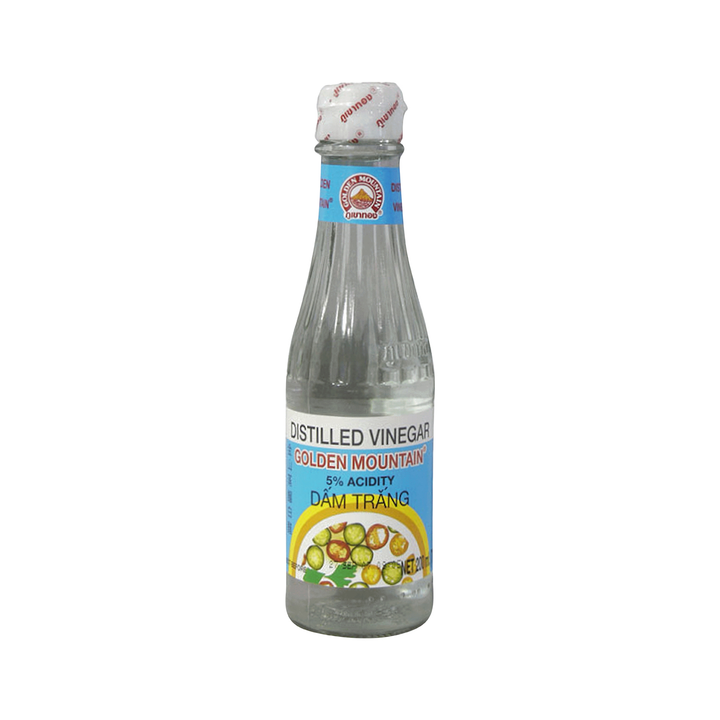 Bottle of distilled vinegar with a label on a white background