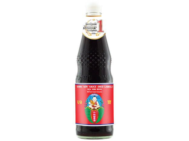 A bottle of Healthy Boy Brand Thin Soy Sauce with a red label featuring an illustration of a figure with a halved orange and green fruit on top.