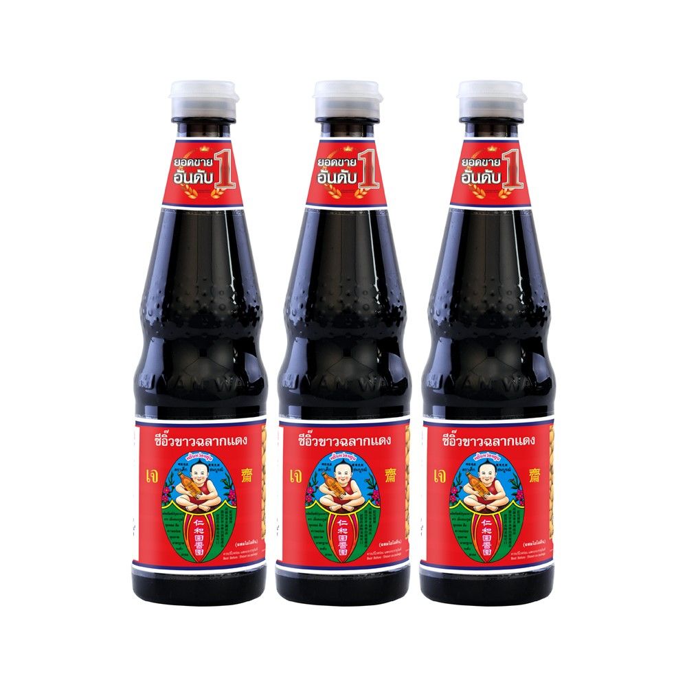 Three bottles of a dark liquid with red labels on a white background