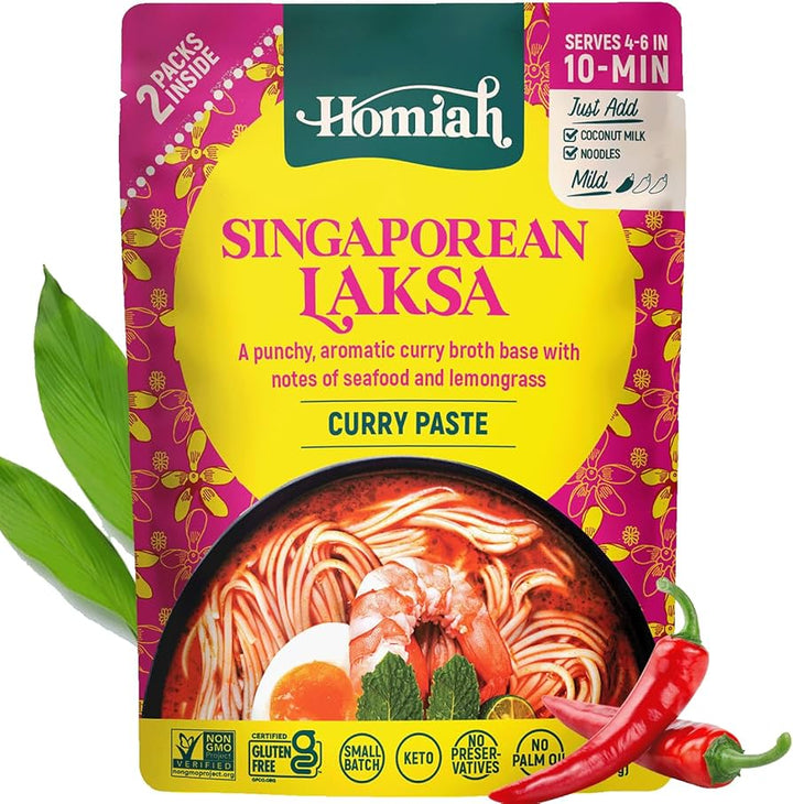 Homiah Singaporean Laksa curry paste package with a bowl of noodles and ingredients on a white background