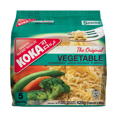 Koka Oriental vegetable-flavored instant noodles packaging with a fork and noodles on a green background