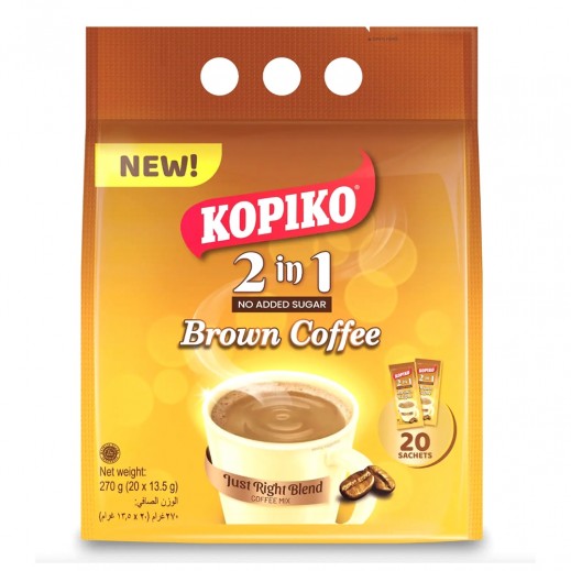 A package of Kopioko 2 in 1 Brown Coffee instant drink mix, featuring a yellow and orange bag with a cup of coffee and coffee beans on the front, set against a plain white background.