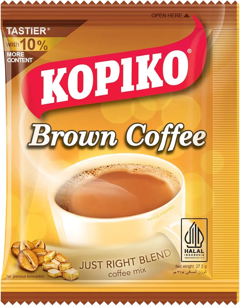 A single packet of Kopiko Brown Coffee, Just Right Blend, featuring a golden-yellow background, a red brand banner with white lettering, and an illustration of a cup of coffee with coffee beans.