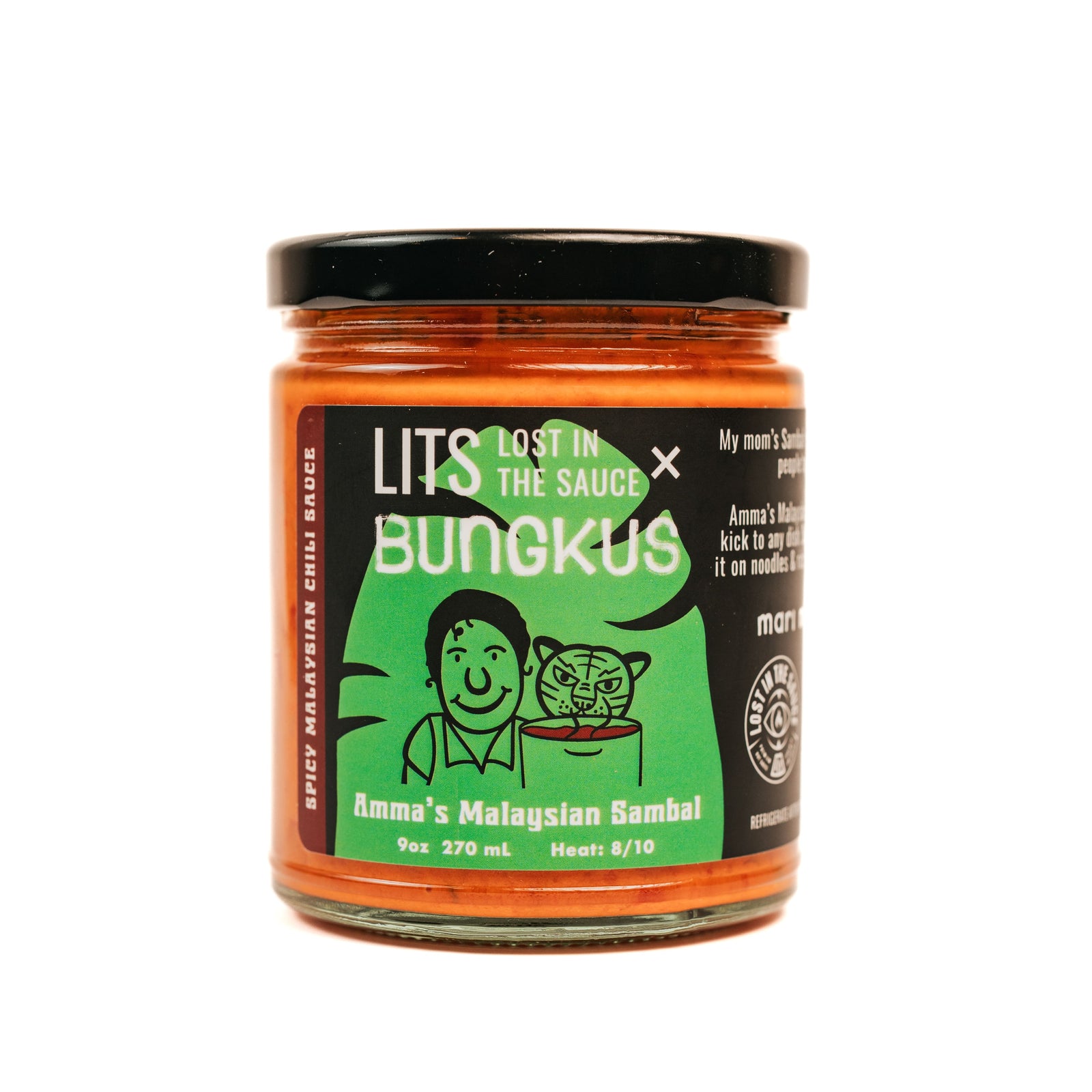 A jar of Amma's Malaysian Sambal hot sauce with a label that includes an illustration of a woman smiling and cooking. The text on the label also provides product information.