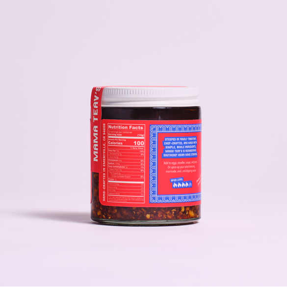 Jar of Mama Tev's product with a red label on a light purple background