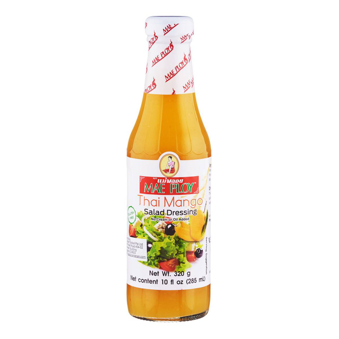 Glass bottle of Mae Ploy Thai Mango Salad Dressing with a label showing the product name and images of mangoes and salad ingredients.