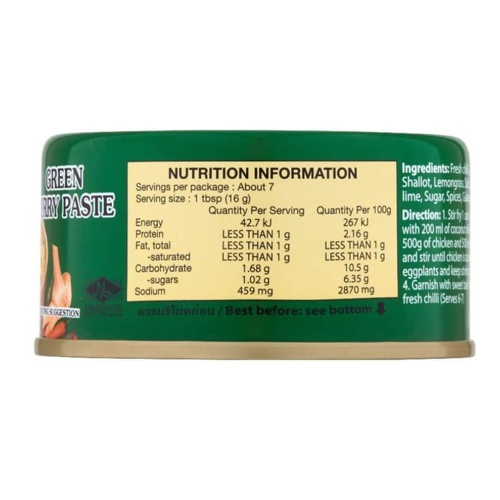 Can of green curry paste with nutrition information label on a white background