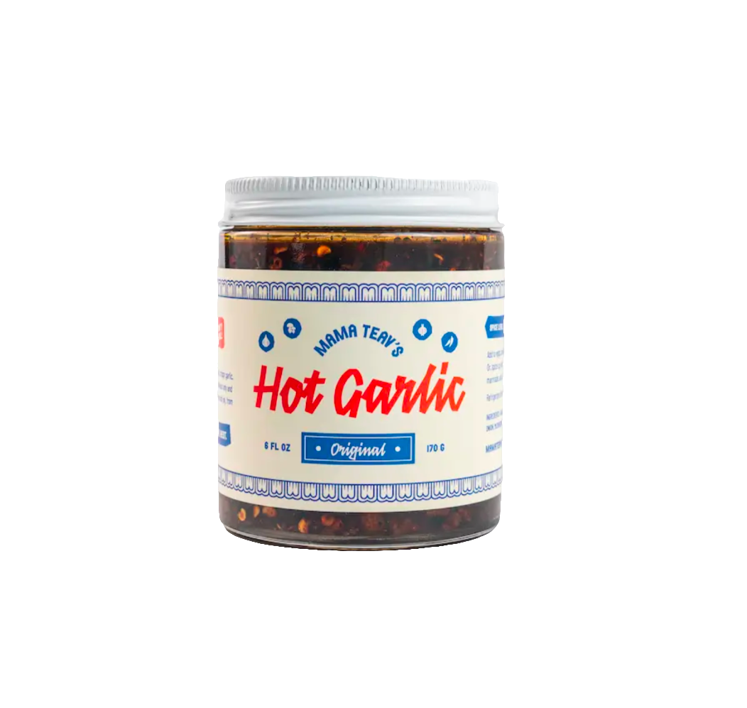 A jar of Mama Teav's Hot Garlic Original sauce with a white and blue label on a white background.