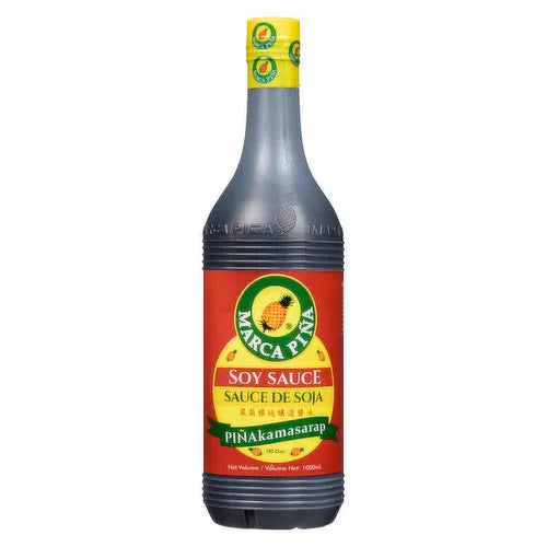 Bottle of soy sauce with a red label and yellow cap on a white background