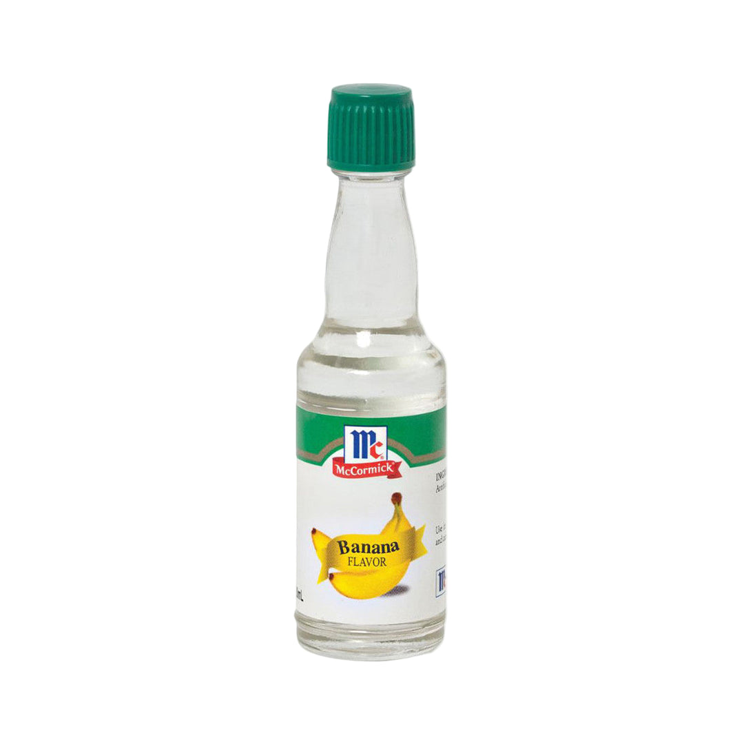 Small glass bottle of McCormick banana flavor extract with images of two yellow bananas on label.