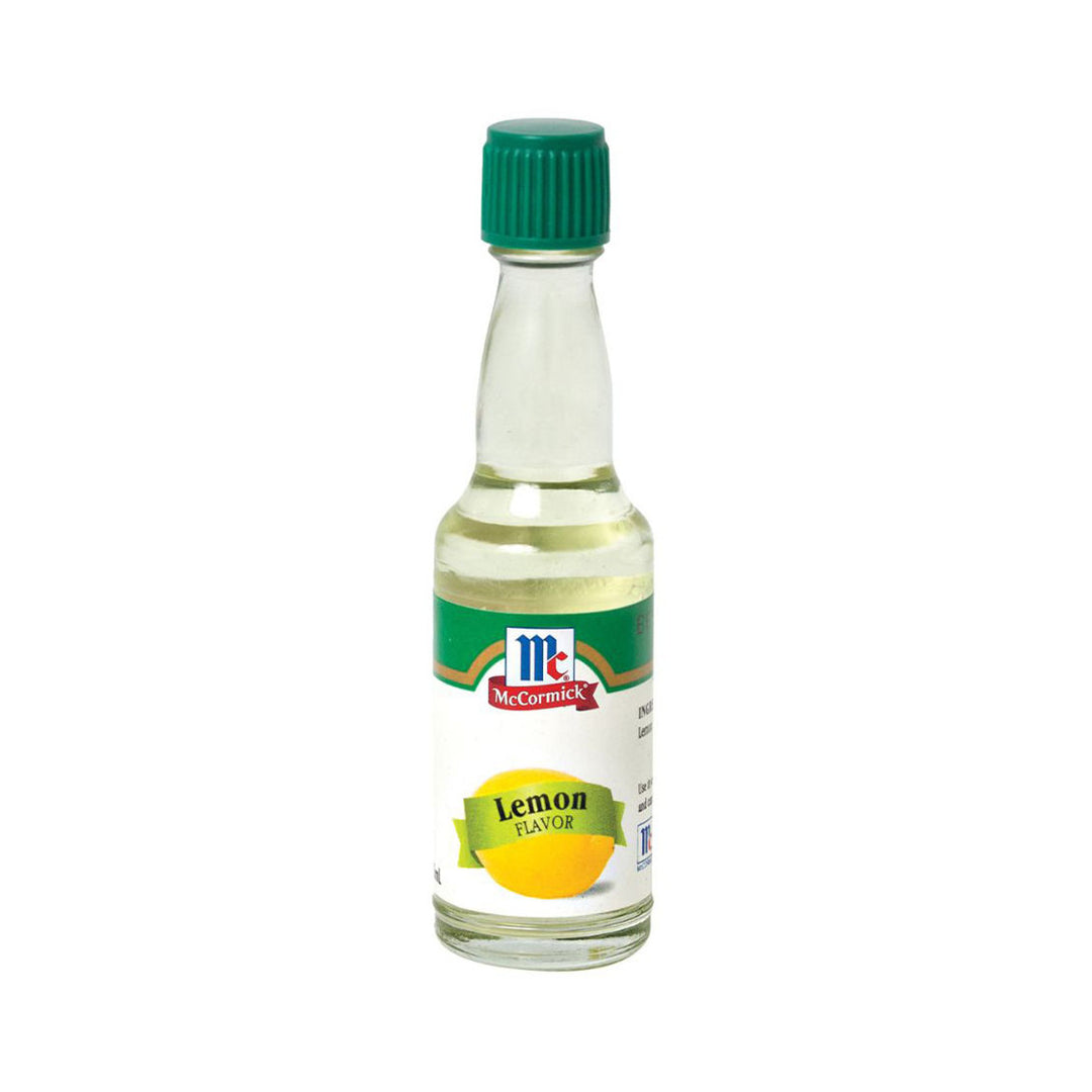 Bottle of McCormick lemon flavor extract on a white background