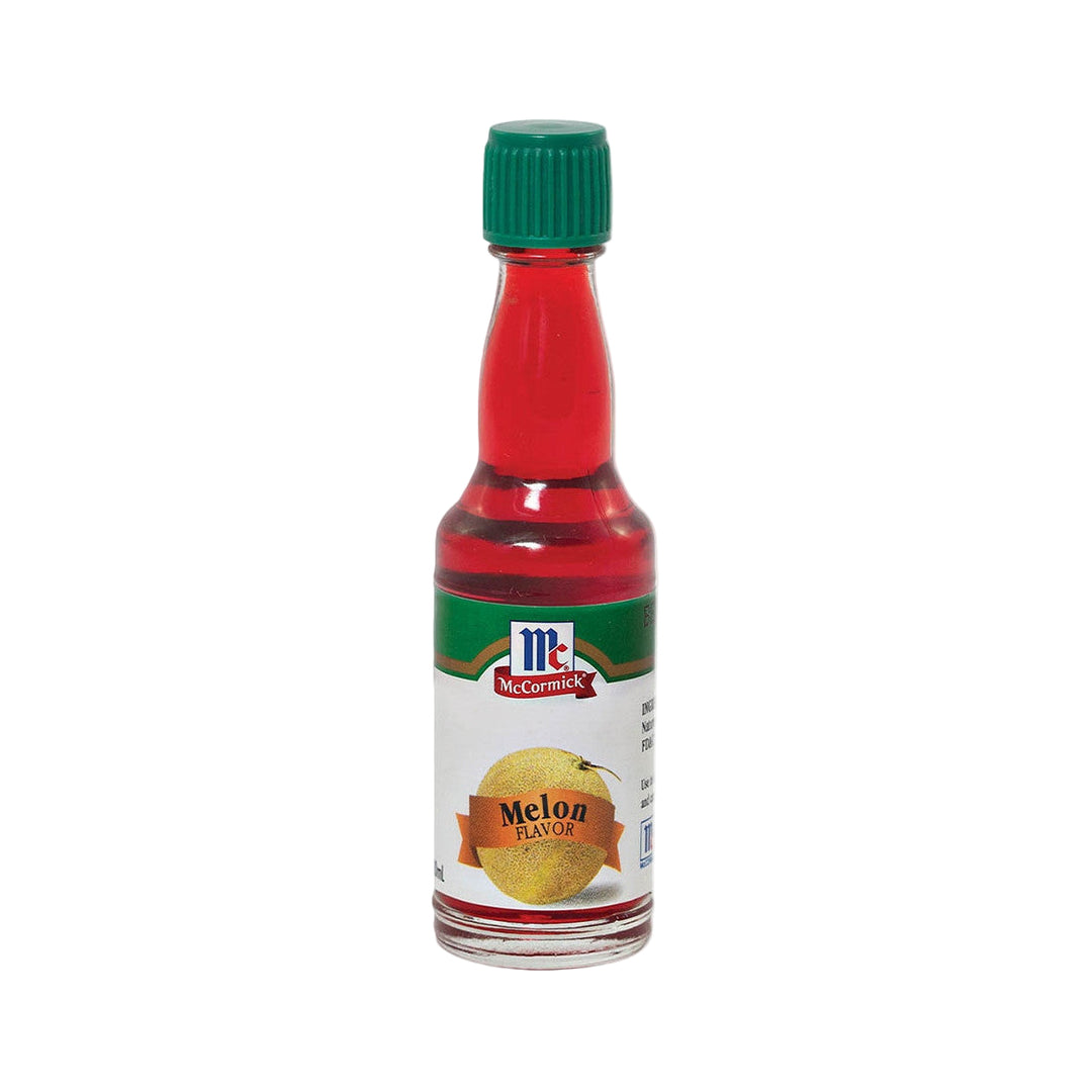 Bottle of McCormick Melon Flavor extract on a white background
