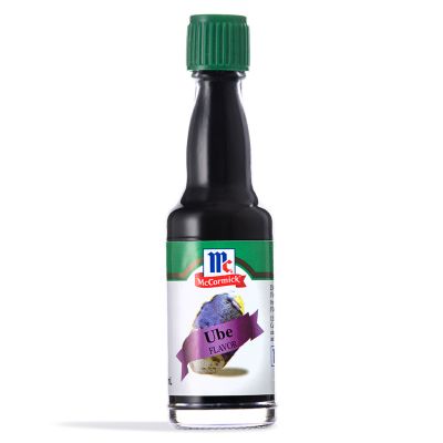 A glass bottle of McCormick Ube Flavor, with a green cap and a label featuring an image of purple yam and the McCormick logo.