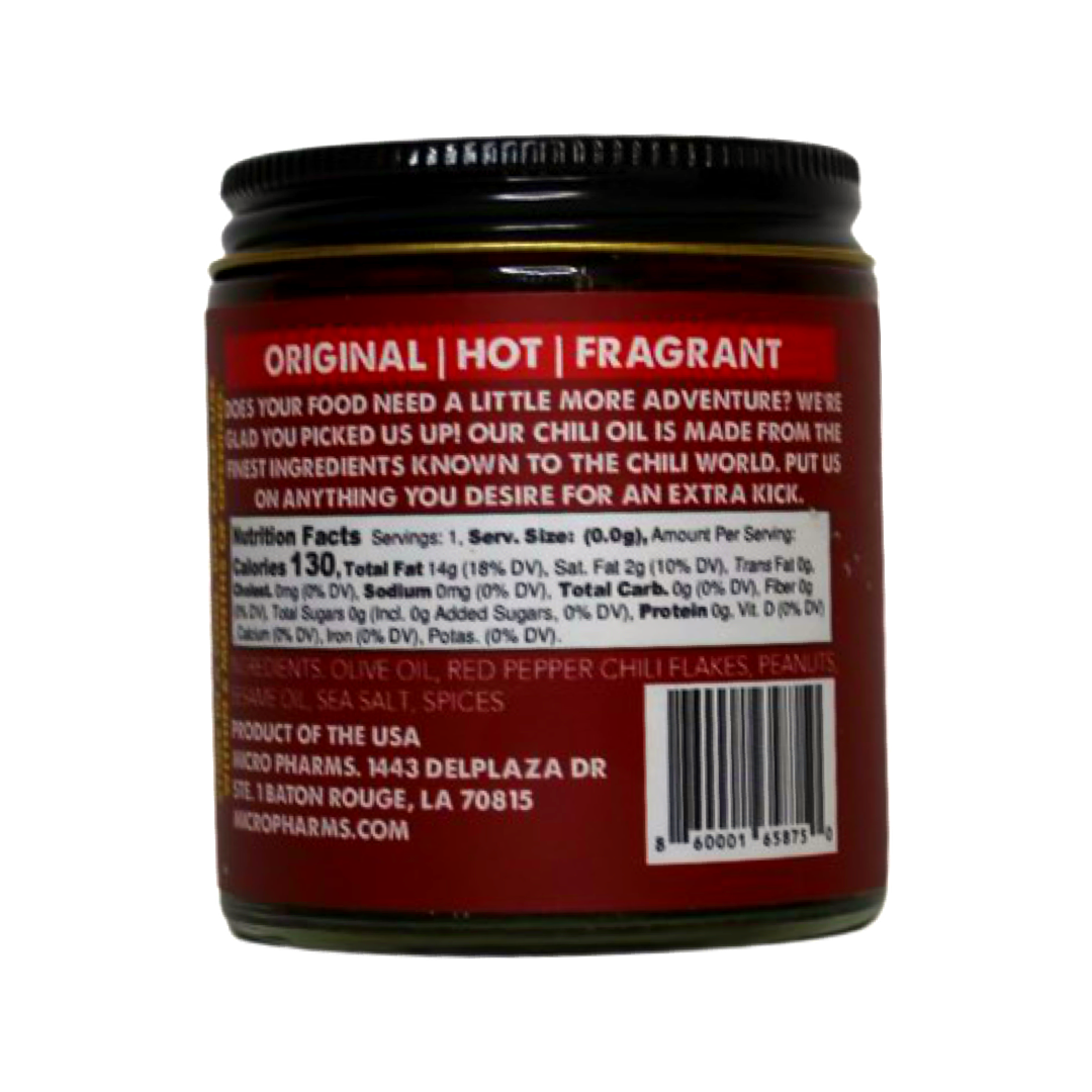 A jar of Red Pepper Chili oil with a black lid and a dark red label showing product details and a barcode.