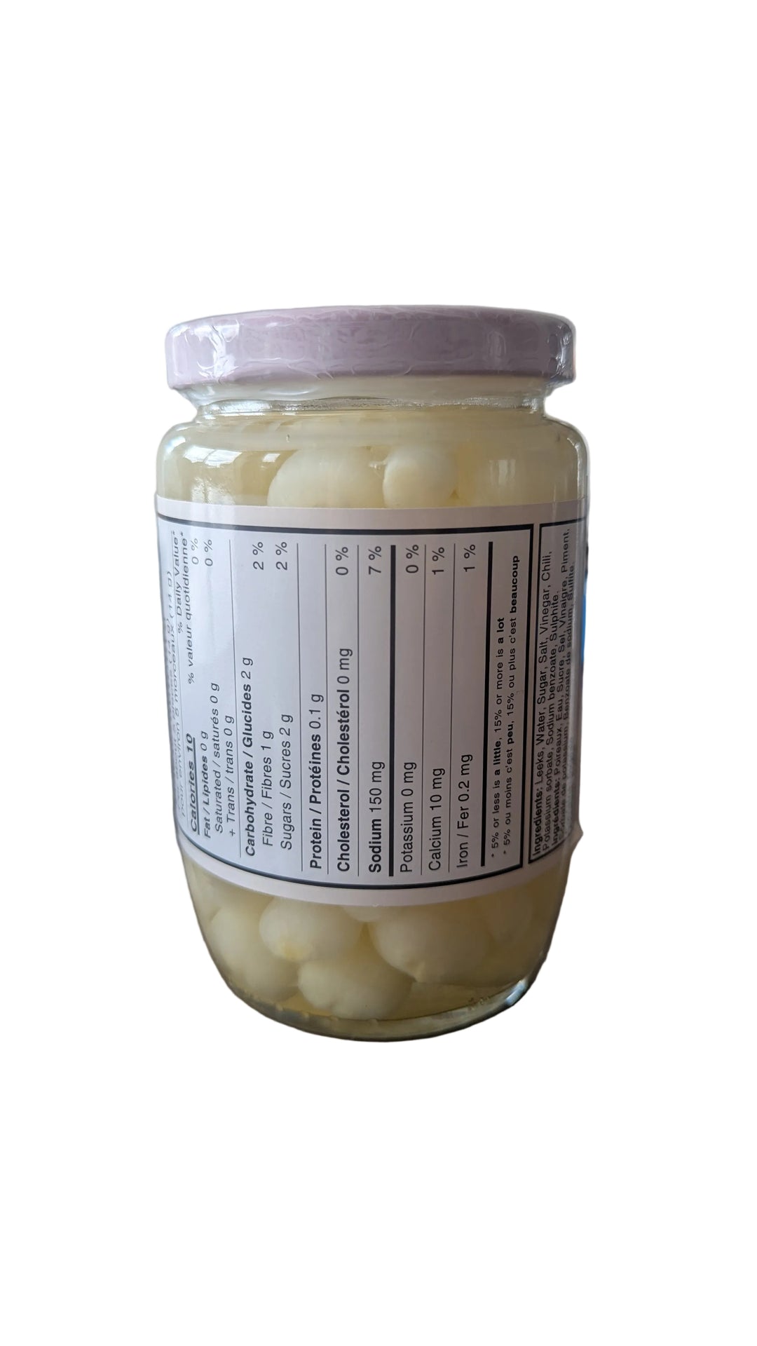 Jar of white固体物质 on a wooden surface with a blurred background