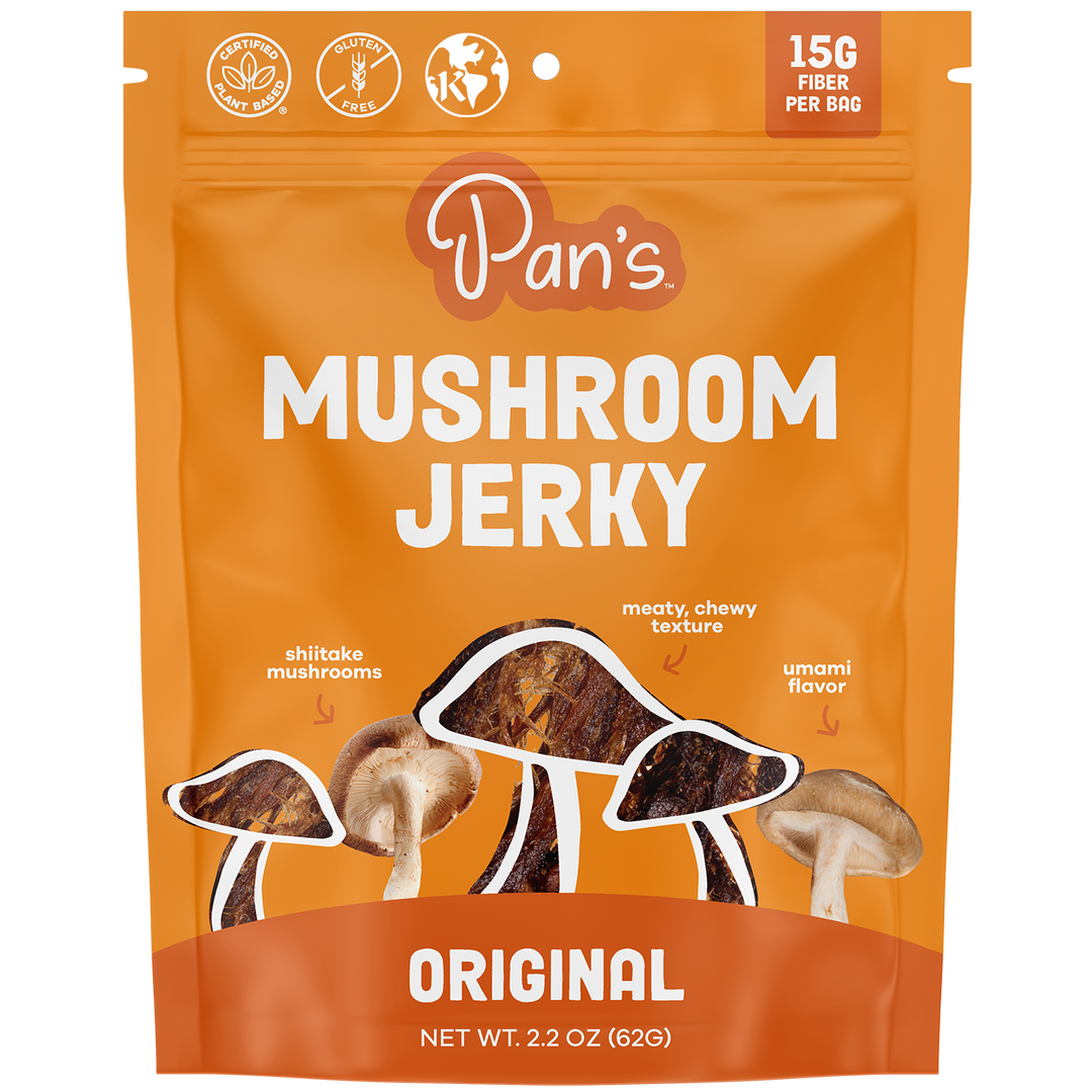 Orange package of Pan's Mushroom Jerky with mushroom illustrations on a white background