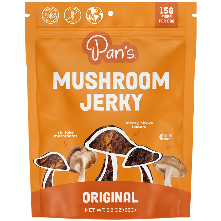 Orange package of Pan's Mushroom Jerky with mushroom illustrations on a white background