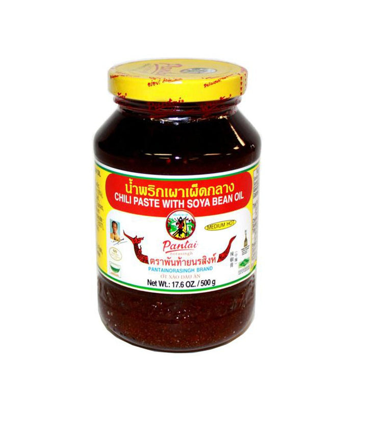 A glass jar of Pantai Chili Paste with Soya Bean Oil, featuring a yellow lid and a white, red, and green label, set against a plain white background.
