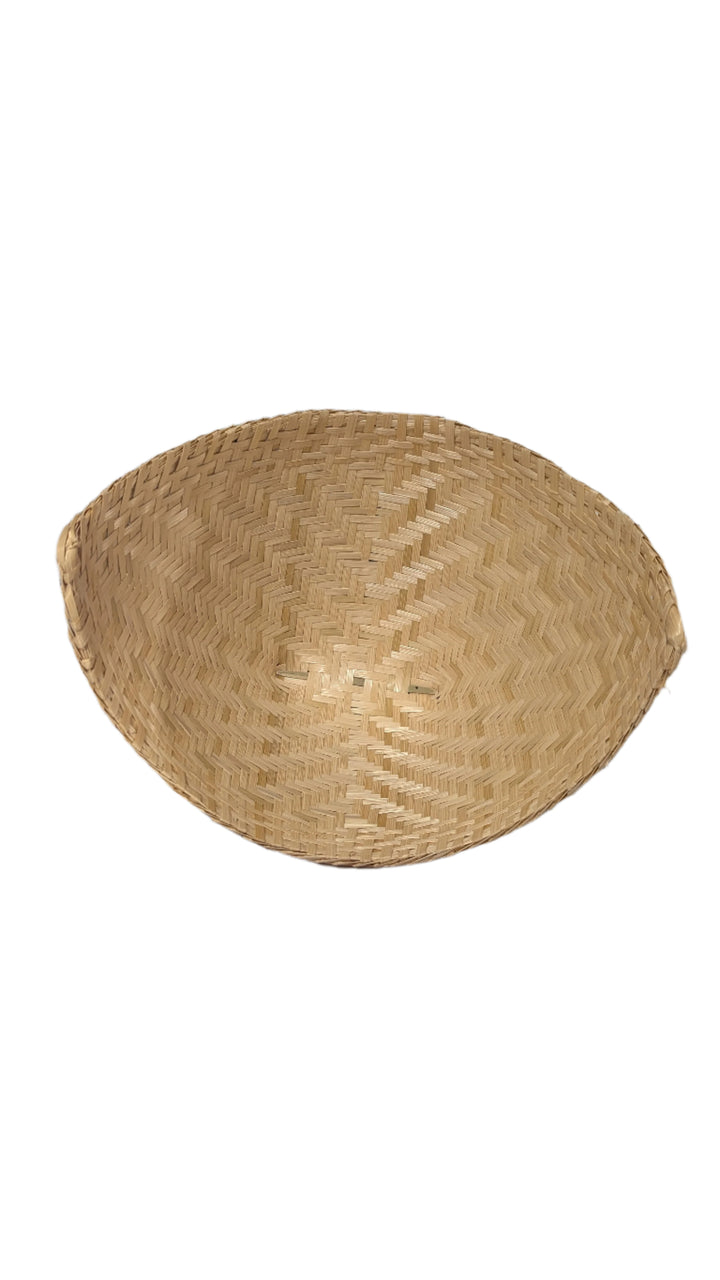 Woven straw rice basket steamer from aerial view on a white background