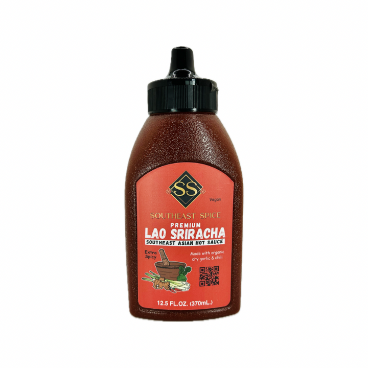 Bottle of Southeast Spice Premium Lao Sriracha with a red label, showcasing the brand logo and product name.