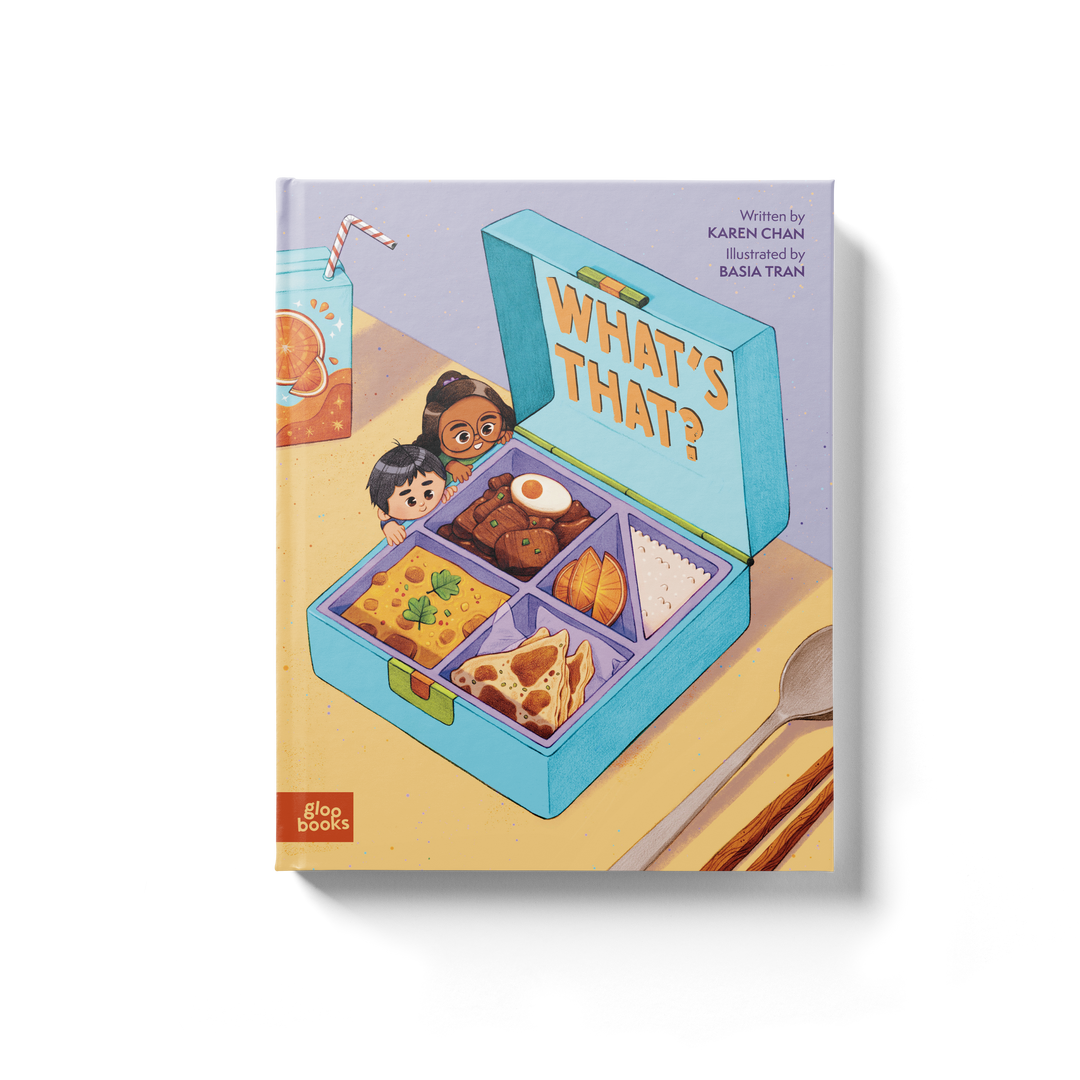 Cover of the children's picture book 'What's That?' depicting a lunch box with various foods and a drink, alongside a character looking curiously.
