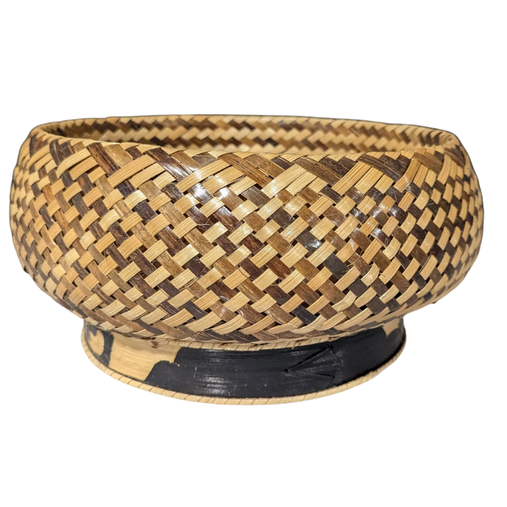 Woven bamboo bowl on a white background