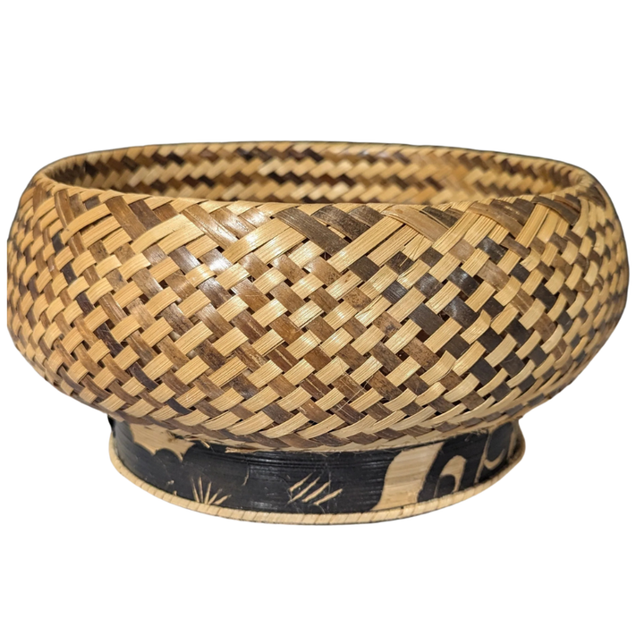 Woven bamboo bowl with black base on a white background
