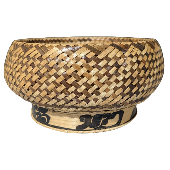 Woven bamboo bowl with a decorative band on a white background