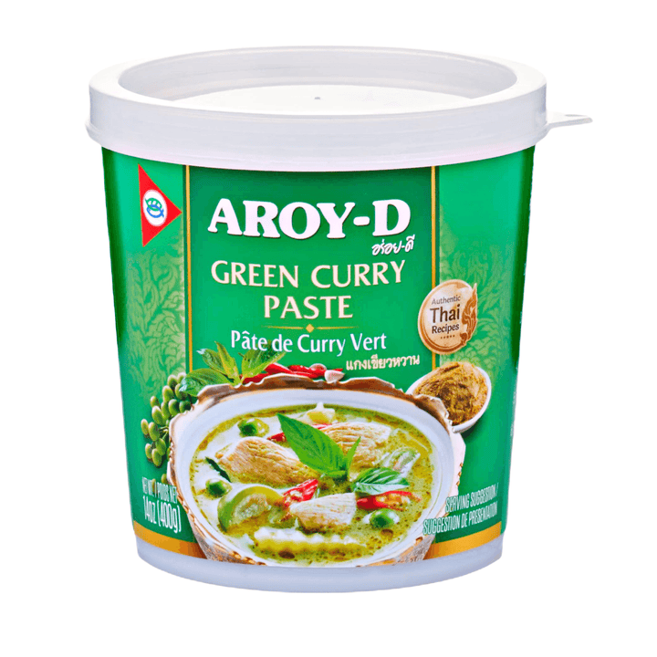Packaging of Aroy-D Green Curry Paste featuring the product name in English and Thai, with an image of a green curry dish and fresh herbs.