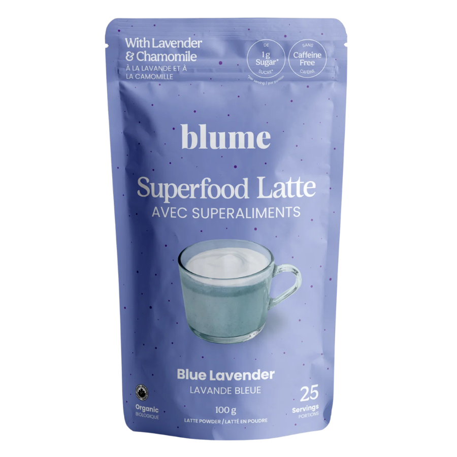 A 100g stand-up pouch of Blume Superfood Latte in Blue Lavender flavor, featuring a light purple-blue background with white text and a graphic of a glass cup of latte.