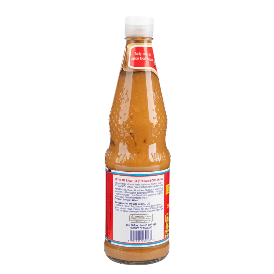 Bottle of sauce with a white label on a white background