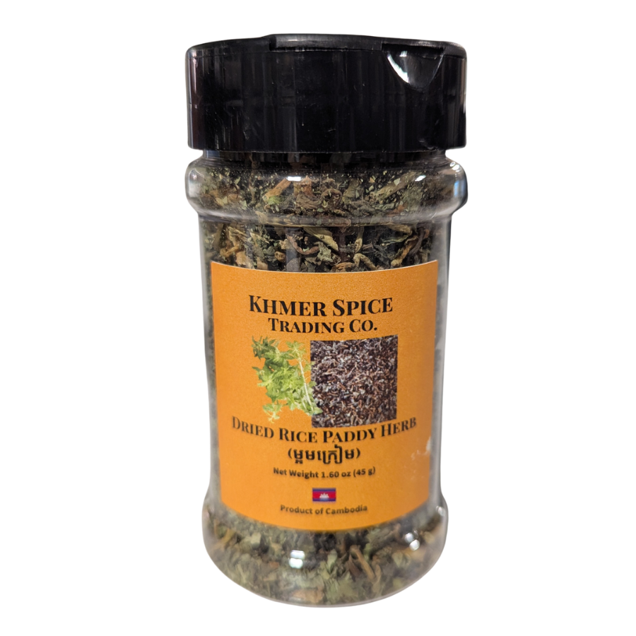 A clear plastic jar of Khmer Spice Trading Co. Dried Rice Paddy Herb with a black lid and an orange label, shown on a plain white background.