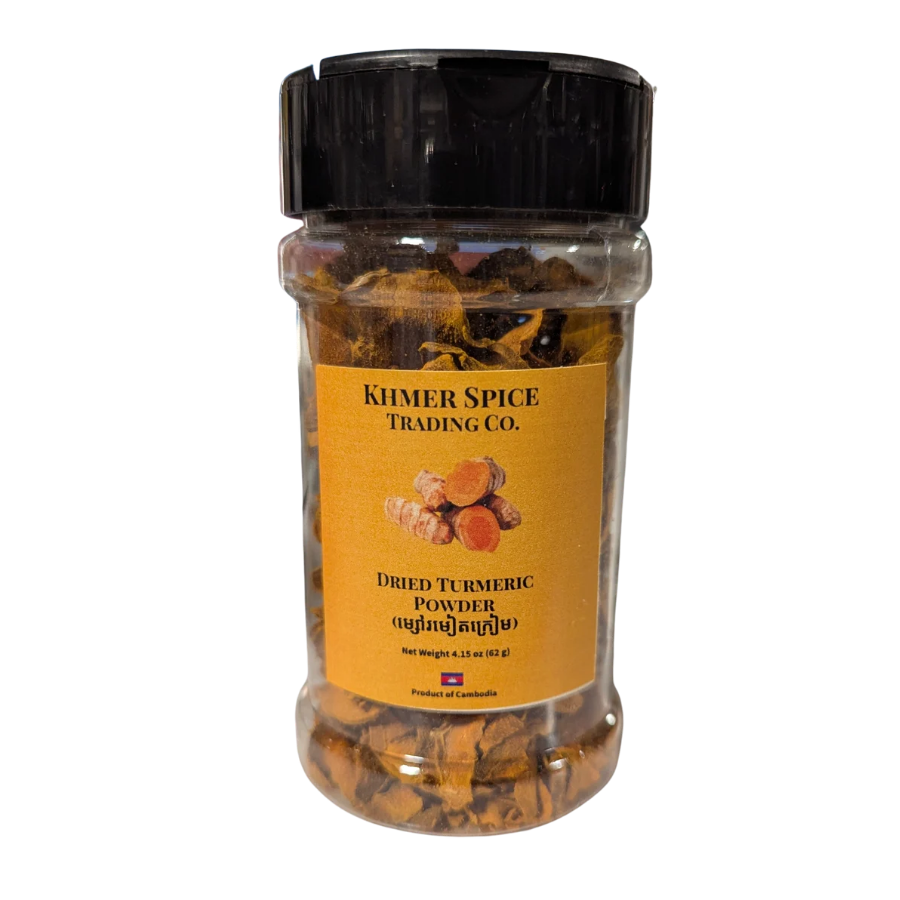 A clear plastic jar of Khmer Spice Trading Co. Dried Turmeric Powder with a black lid and a yellow label, set against a plain white background.