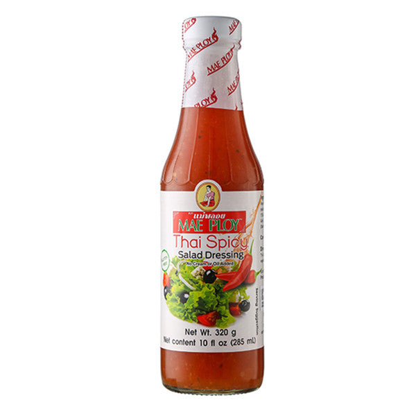 A glass bottle of Mae Ploy Thai Spicy Salad Dressing on a plain white background. The bottle is filled with red dressing and features a white label with red and green graphics, and the cap is sealed with a white band printed with red 'MAE PLOY' text.