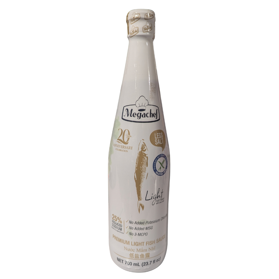 A 720 mL glass bottle of Megachel Light Fish Sauce on a plain white background. The bottle is off-white with a gold cap, featuring a central illustration of a fish and gold and blue text and logos.