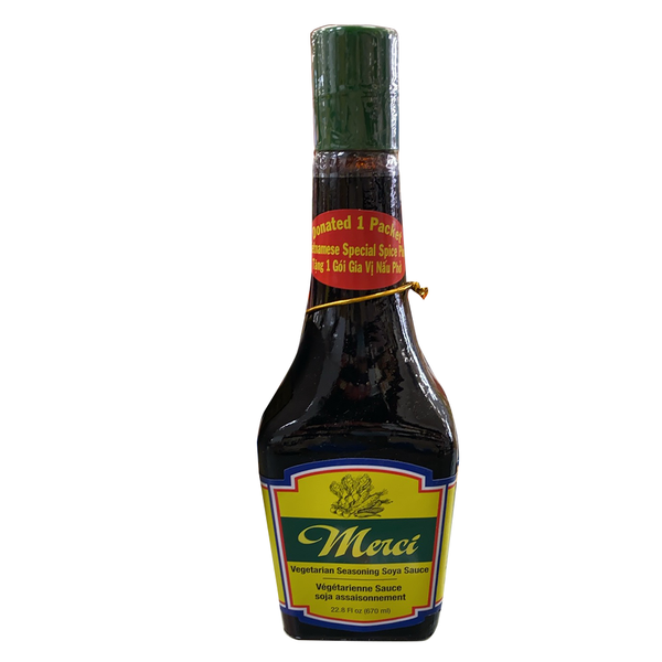 Bottle of Merci Vegetarian Seasoning Soya Sauce with a green label, text, and a red cap.