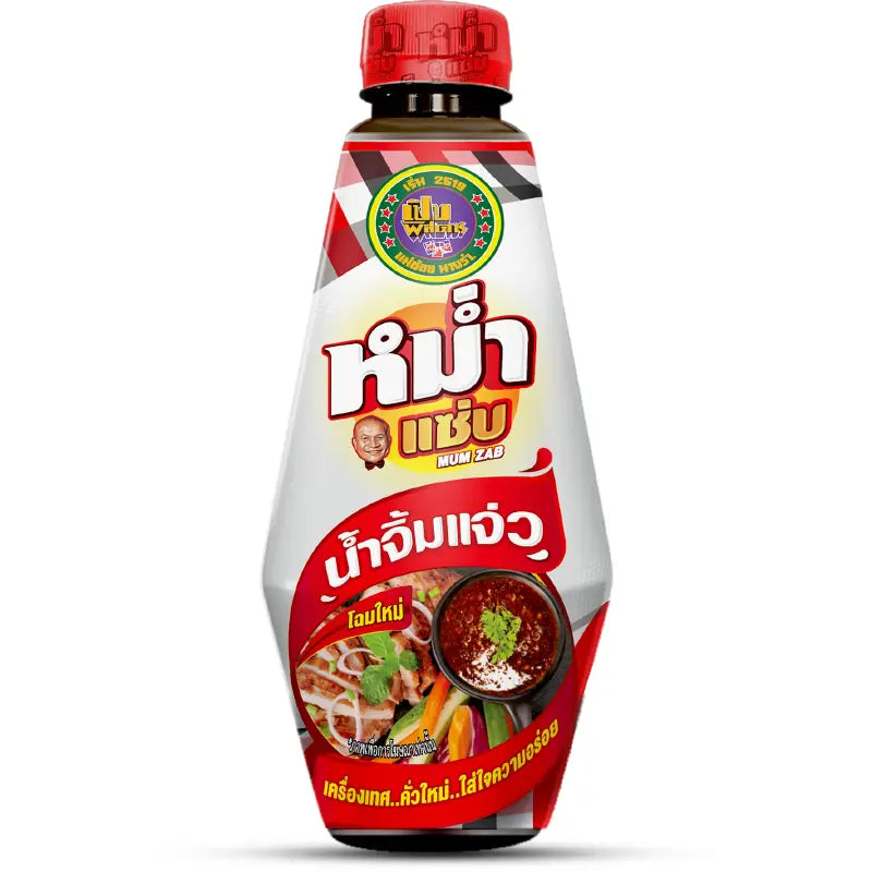 A bottle of Thai fermented fish sauce with Thai text on the label, featuring a red cap and a white and red bottle design with food illustrations.