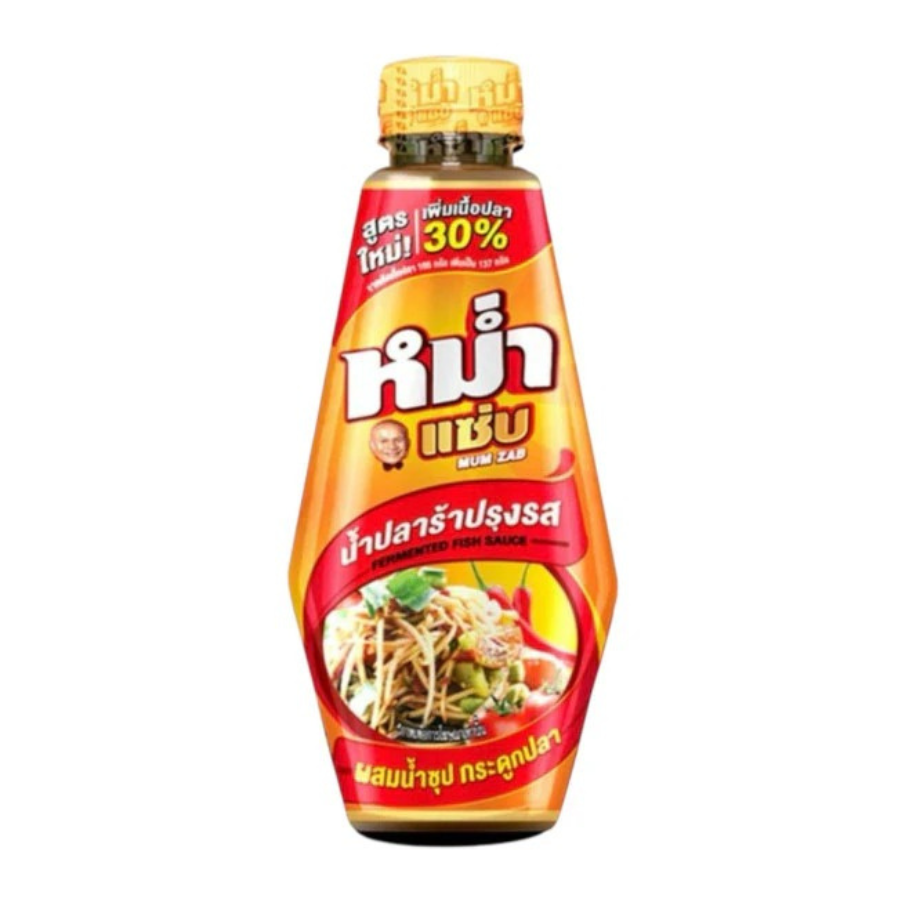 Bottle of fish sauce with a red label on a white background
