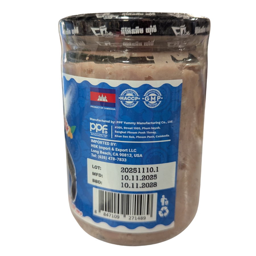 Jar of chocolate powder with a blue label showing certification logos and product details.