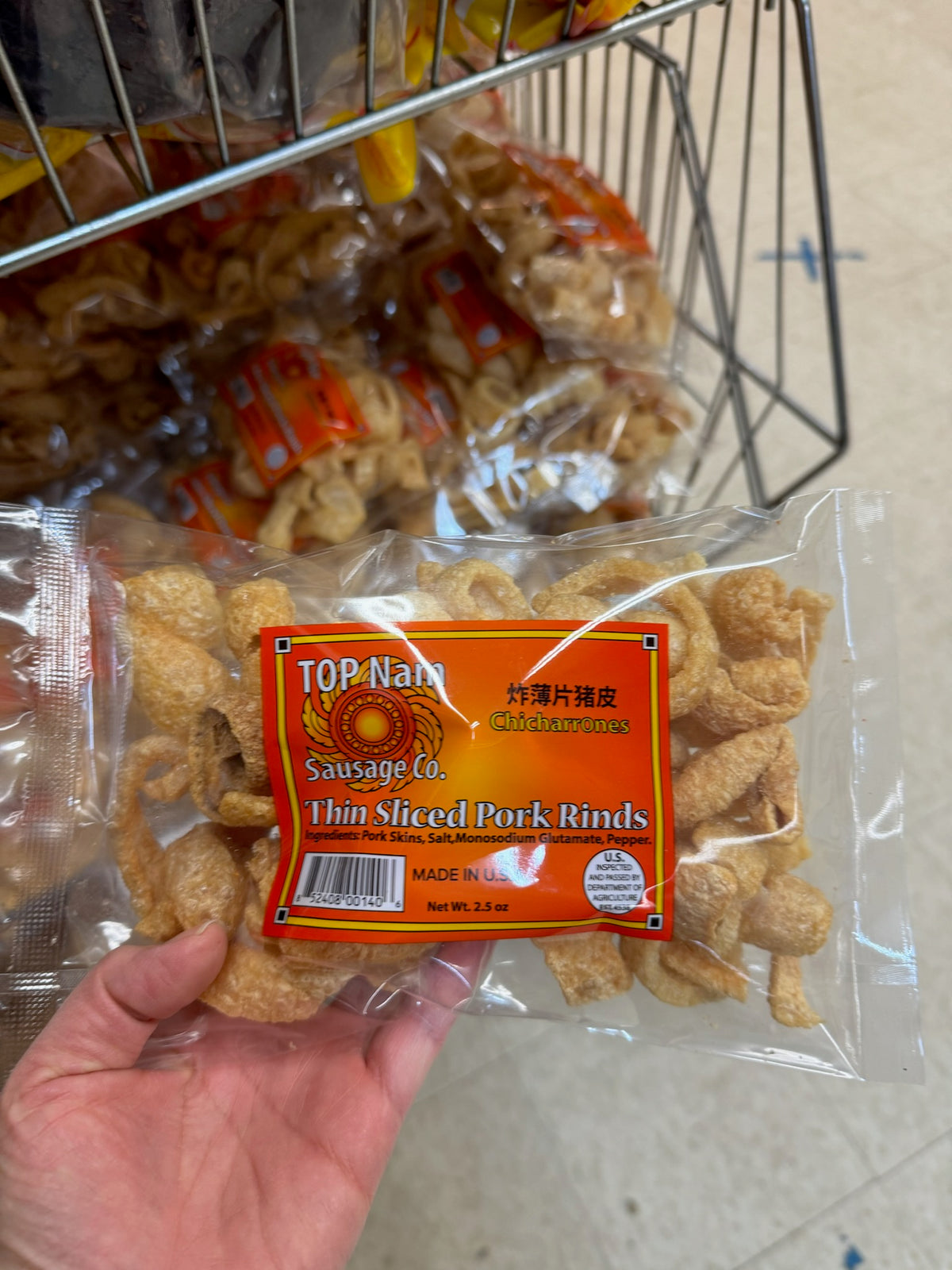 Packaged TOP Nam Thin Sliced Pork Rinds in a clear plastic bag with an orange label, showing the product name and weight information.
