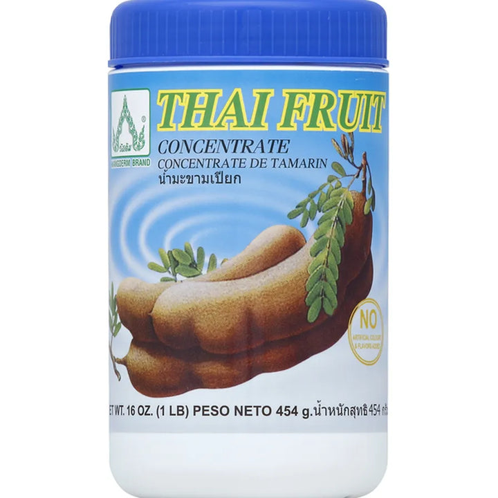 Jar of Thai Fruit Concentrate with blue lid and label showing tamarind pod illustration.