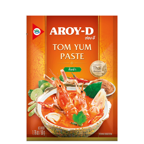 Packaging of Aroy-D Tom Yum Paste showing the product name, brand logo, and an image of a dish containing shrimp and herbs, indicative of the product's Thai culinary origin.