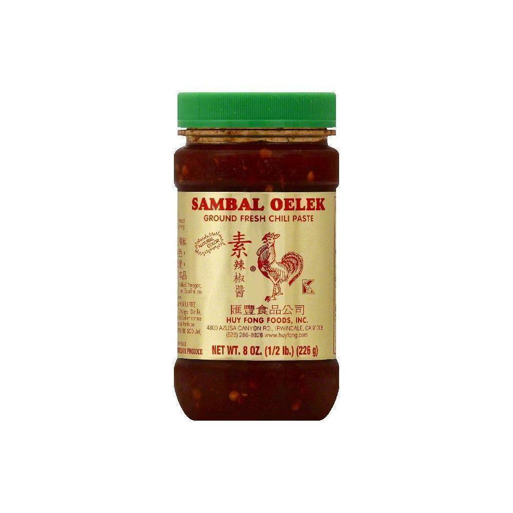 A jar of Huy Fong Sambal Oelek Ground Fresh Chili Paste with a green lid and a label displaying the product name and weight.