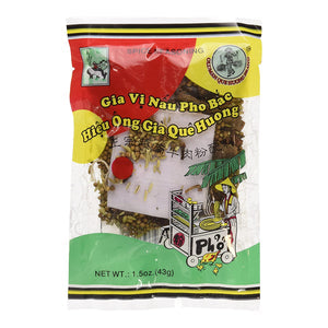 Packaging of Old Man Que Huong Pho Bac Spice Seasoning, showing the product name and a clear window revealing the spices inside.
